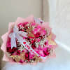 Red and pink roses with baby's breath, chocolates, butterfly, and personalized ribbon.