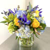 Wild flower bouquet in a vase. Variety of flowers in blue, yellow