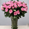 100 premium long stem roses. This grand arrangement stands taller than 28''