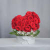 This elegant heart-shaped arrangement features 32 premium Ecuadorian roses, imported directly from
