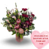 Devotion is a bold and romantic arrangement featuring rich red roses, striking