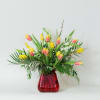 This stunning flower arrangement is a fresh and lively display that captures