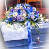 This elegant casket spray is a graceful expression of love, remembrance, and