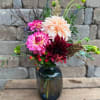 A bouquet of vibrant blooms in a vase. This arrangement is sure