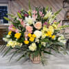 Traditional, large floral arrangement. 