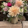 A mix of greens that allow the dahlia to take center stage