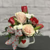 Pink roses and red tulips adorn this perfectly cute Valentine's mug to