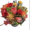 Fall in love with something beautifully unexpected. This stunning arrangement blends passionate