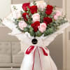 Bouquet of 12 stems of red and pink roses with lots of