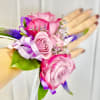 Made from fresh flowers, a corsage looks like a petite flower arrangement