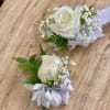 Made from fresh flowers, a corsage looks like a petite flower arrangement