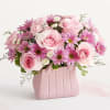 The ultimate arrangement for your favorite fashionista. A profusion of roses, poms