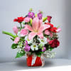 This timeless, classic romance bouquet features pink and red hues, accented with