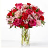 
Blushing shades of pink blooms are nestled in lush greens to charm