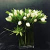 Tulips in a lush grouping. Succulent at base anchoring it together. Lily