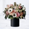 Celebrate any special occasion with Maribelis, a stunning floral arrangement that radiates