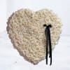 This breathtaking 24in heart-shaped funeral arrangement features ivory roses, artfully arranged into