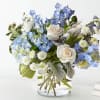 This uplifting arrangement be reminders of the clear skies ahead. Capturing the