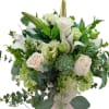 A serene and elegant arrangement featuring creamy white roses, graceful lilies, fresh