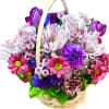 A cheerful and vibrant flower basket filled with a delightful mix of