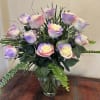 This bouquet of variegated lavender , pink and cream sparkly roses with