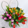 Fresh tulip arrangement&nbsp;in three&nbsp;colors of 30 tulips, with a heart to top