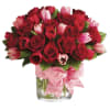 A bountiful dramatic arrangement of red, and pink tulips and red, and