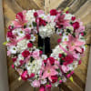 The Forever Fuchsia heart features white hydrangea, pink lilies, hot and light