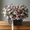 basket of pink roses with eucalyptus