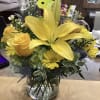A fresh arrangement with beautiful yellow flowers to bring a pop of