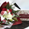 A beautiful bouquet flowers all wrapped in a beautiful paper. Comes with