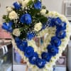 This is a beautiful heart with blue roses.