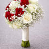 This traditional white bridal bouquet is a lavish celebration of fine roses.