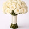 This traditional white bridal bouquet is a lavish celebration of fine large-headed