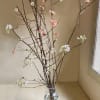 Gorgeous bundle of blooming branches like quince, cherries or peach. Placed in