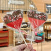 A festive heart-shaped treat dipped in rich chocolate and topped with Valentine