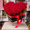 Elegant heart-shaped arrangement featuring 36 fresh red roses, presented in a sleek