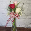 Bud vase with a white, pink and red rose 