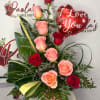 The Blushing Love Rose Arrangement features a beautiful combination of fresh red