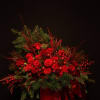 A breathtaking premium floral box filled with lush red roses, festive holiday