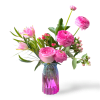 This beautiful arrangement has pink roses, hypericums, ranunculus, tulips, israeli ruscus and
