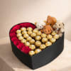 Love and hugs in a heart shape box of flowers and chocolate