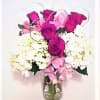 6 roses,white hydrangeas,and pink alstromeria in a clear vase with silver hearts