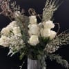 Tall two dozen in stunning vase and surrounded by beautiful greens and