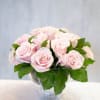 18 soft pink roses designed with greenery in glass pedestal vase measuring