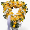 A beautiful tribute in yellow and white seasonal blossoms arranged in a