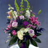 Rich and elegant. A collection of purple and hot pink flowers composed