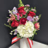 A designer's choice Valentine's Day arrangement in our white ceramic Hugs &amp;
