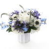 The blue and white flower arrangement is just perfect in all aspects.