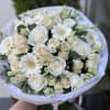 A delicate bouquet in white and peach tones.

The photo shows the deluxe